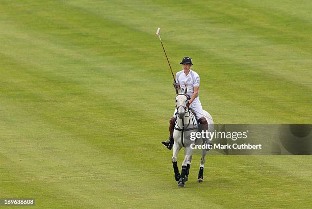 Prince William, Duke of Cambridge playing in the Audi Polo Challenge at Chester Racecourse on May 29, 2013 in Chester, England.