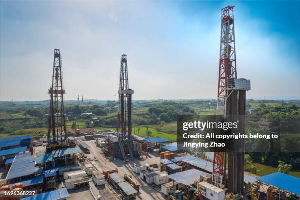 aerial photography of large-scale drilling sites for shale gas in sichuan - oil drill stock pictures, royalty-free photos & images