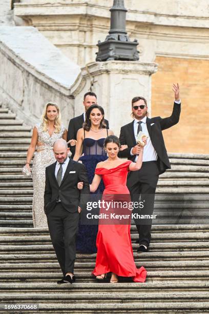 Team players Sam Burns, his wife Caroline Campbell, Brian Harman, his wife Kelly Van Slyke and Wyndham Clark and his partner Julia Kemmling arrive...