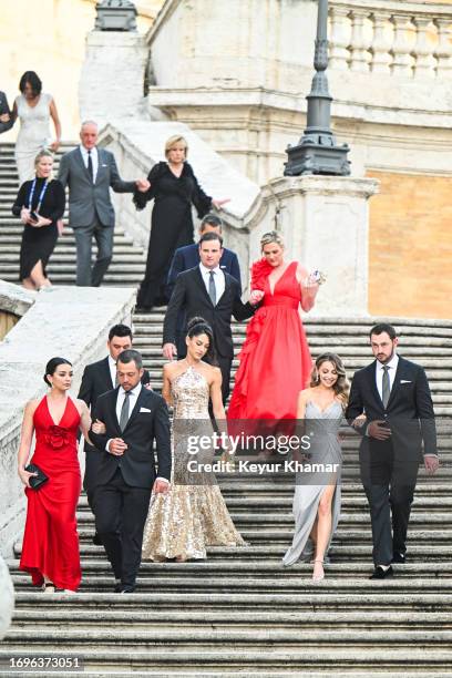 Team members Xander Schauffele, his wife Maya Lowe, Rickie Fowler, his wife Allison Stokke, Patrick Cantlay and his wife Nikki Guidish and Captain...