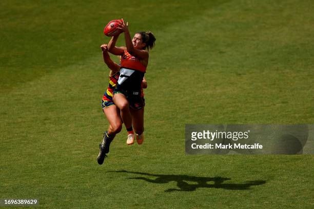 Ally Dallaway of the Giants takes a mark over Kiera Mueller of the Crows during the round four AFLW match between Greater Western Sydney Giants and...