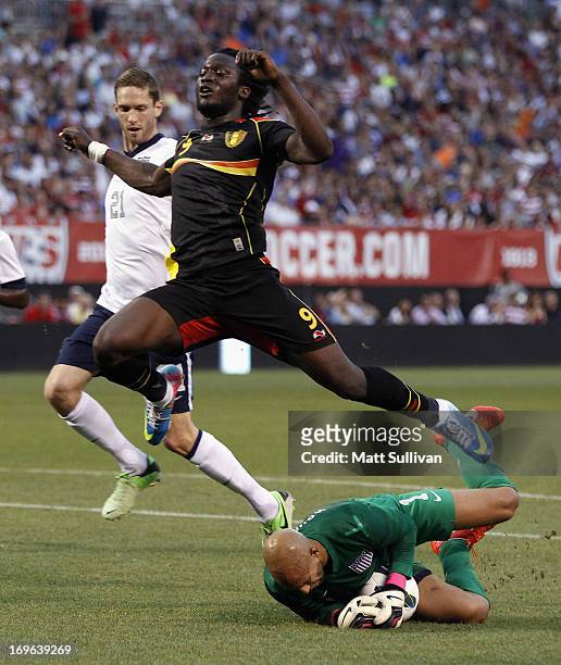 Tim Howard of the U.S. Mens National Team makes a save as Clarence Goodson and Romelu Lukaku of Belguim avoid him during their International Friendly...