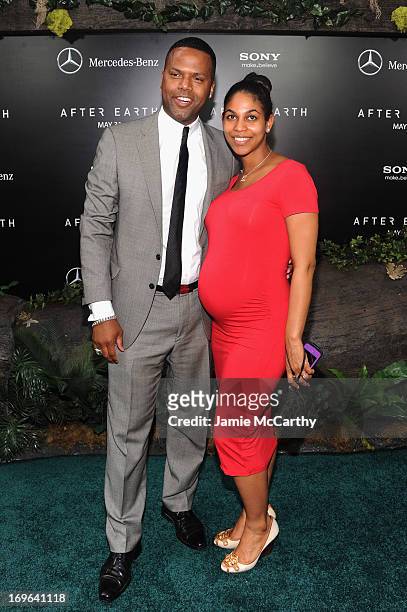 Television personality A.J. Calloway and Dionne Walker attend Columbia Pictures and Mercedes-Benz Present the US Red Carpet Premiere of AFTER EARTH...