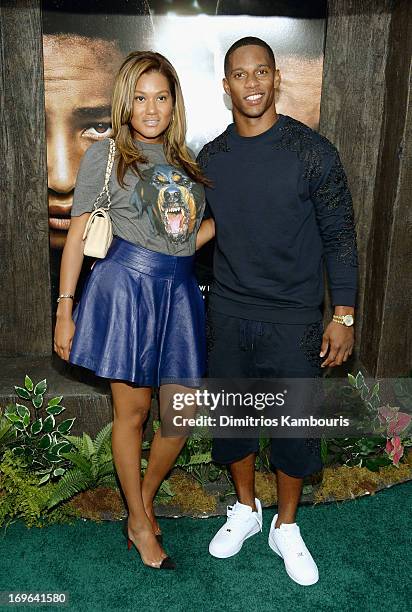 Elaina Watley and professional football player Victor Cruz attend the "After Earth" premiere at the Ziegfeld Theater on May 29, 2013 in New York City.