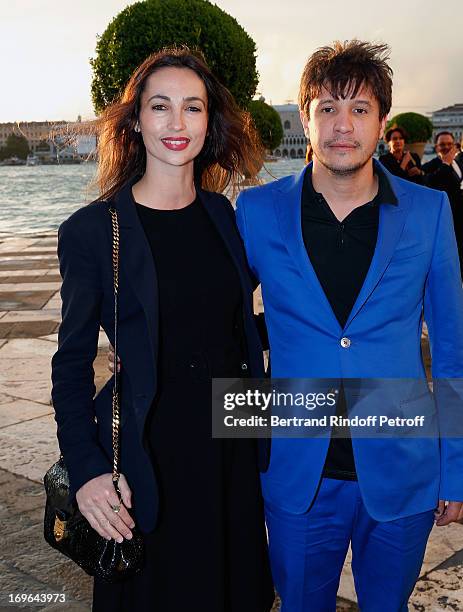 Adel Abdessemed and his wife Julie arrive at the Dinner At 'Fondazione Cini, Isola Di San Giorgio on May 29, 2013 in Venice, Italy.