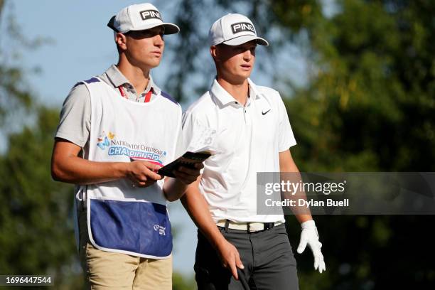 William Mouw of the United States and his caddie line up a shot from the 12th tee during the second round of the Nationwide Children's Hospital...