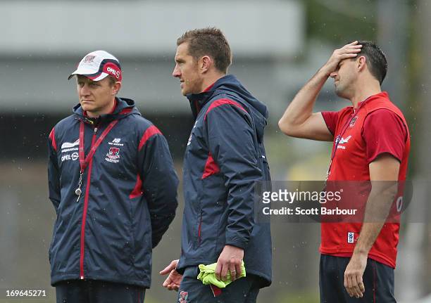 Mark Neeld the coach of the Demons, and Jade Rawlings backline coach for the Demons look on during a Melbourne Demons AFL training session at Gosch's...
