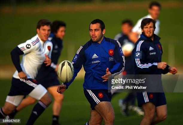 Thomas Domingo of France passes during a France rugby training session at Onewa Domain on May 30, 2013 in Takapuna, New Zealand.