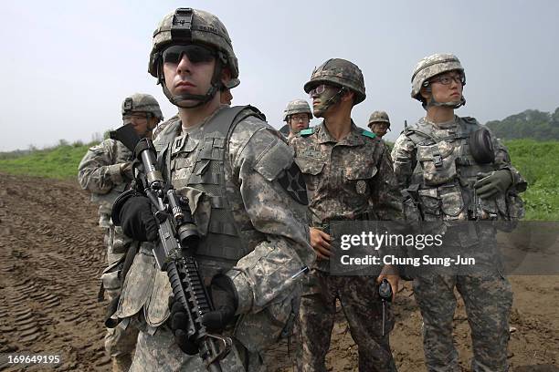 Soldiers from 2nd Battalion, 9th Infantry Regiment of the 1st Armored Brigade Combat Team of 2nd infantry division and South Korean soldiers from 6th...