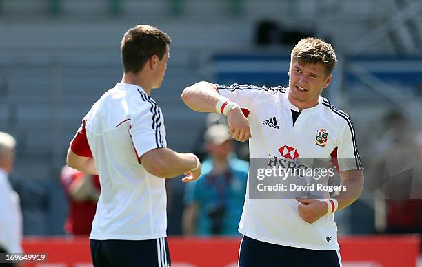 Owen Farrell talks to Jonny Sexton during the British and Irish Lions training session held at the Aberdeen Sports Stadium May 30, 2013 in Hong Kong.