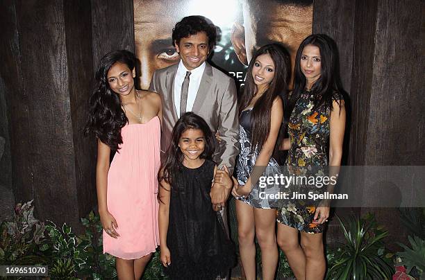 Director M. Night Shyamalan and family attend the "After Earth" premiere at the Ziegfeld Theater on May 29, 2013 in New York City.