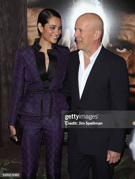 Actor Bruce Williis and wife Emma Heming attend the "After Earth" premiere at the Ziegfeld Theater on May 29, 2013 in New York City.