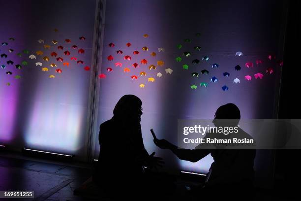 Female delegate is interviewed by a journalist during The Women Deliver Conference on May 30, 2013 in Kuala Lumpur, Malaysia. The WD conference...