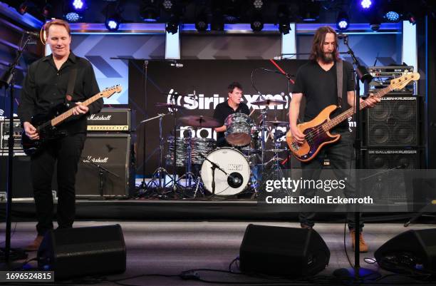 Bret Domrose, Robert Mailhouse, and Keanu Reeves of Dogstar perform at SiriusXM Studios on September 22, 2023 in Los Angeles, California.