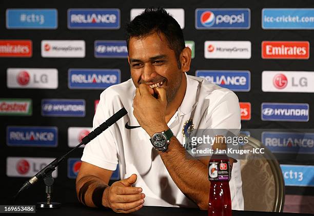 Mahendra Singh Dhoni talks to the media during an ICC Champions Trophy press conference at the Hyatt Hotel on May 30, 2013 in Birmingham, England.