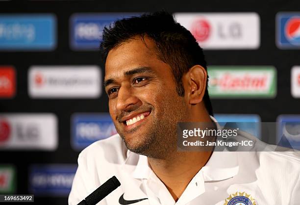 Mahendra Singh Dhoni talks to the media during an ICC Champions Trophy press conference at the Hyatt Hotel on May 30, 2013 in Birmingham, England.