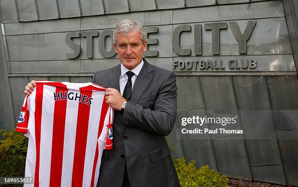 New Stoke City manager Mark Hughes poses for a photograph during the press conference at the Clayton Wood Training Ground on May 30, 2013 in...