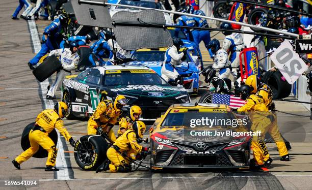 Christopher Bell, driver of the DEWALT Perform & Protect Toyota, pits during the NASCAR Cup Series Hollywood Casino 400 at Kansas Speedway on...