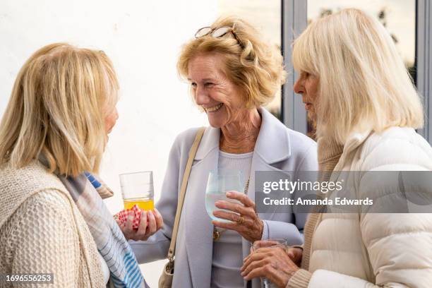 Former talent agent Ames Cushing, writer Anne Taylor Fleming and former magazine editor Caroline Cushing Graham attend the book launch party for...