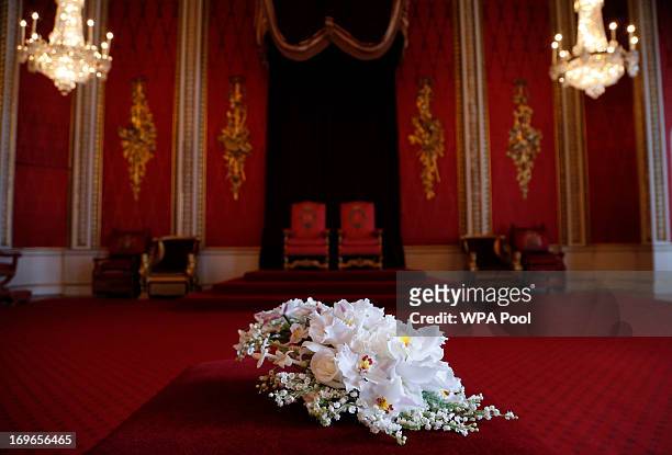 Replica of the Coronation Bouquet is presented to Queen Elizabeth II by the Worshipful Company of Gardeners in the Throne Room against the backdrop...