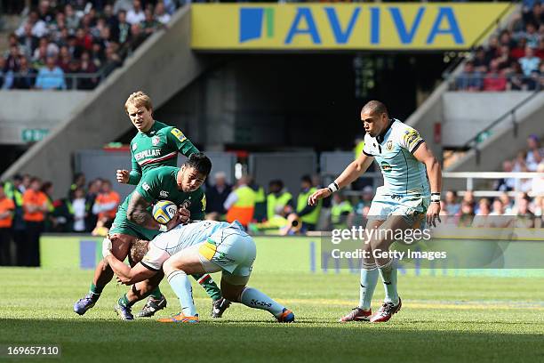 Manu Tuilagi of Leicester Tigers is tackled during the Aviva Premiership Final between Leicester Tigers and Northampton Saints at Twickenham Stadium...