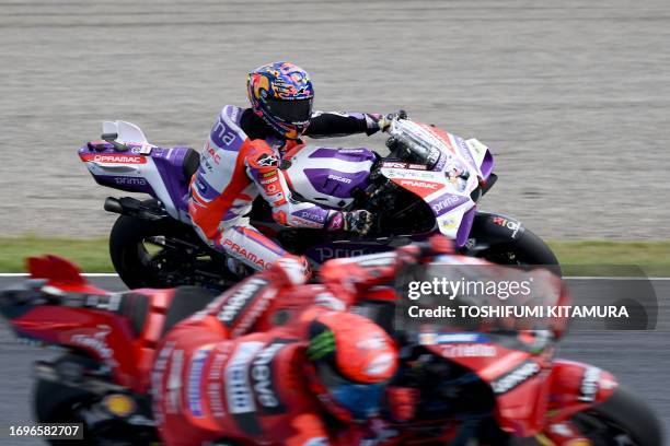 Prima Pramac Racing rider Jorge Martin of Spain and Ducati Lenovo Team rider Francesco Bagnaia of Italy compete during the MotoGP class free practice...