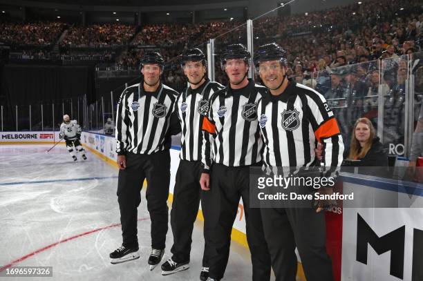 Linesman Matt MacPherson, linesman Bevan Mills, referee Kevin Pollock and referee Ghislain Hebert look on prior to the NHL Global Series match...