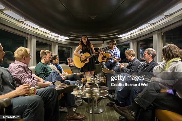 Musician Melanie Brulee and guitarist Dylan Groulx entertain a small crowd in the Park car as it travels towards its next stop in Saskatoon aboard...