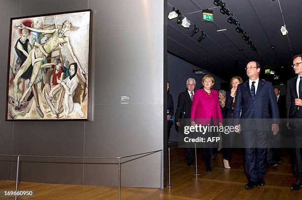French President Francois Hollande and German Chancellor Angela Merkel visit the exhibition "German Thought and Painting, from Friedrich to Beckmann"...
