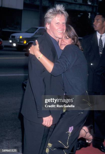 Actor Gary Busey and wife Tiani Warden attend the Screening of the TNT Original Movie "Rough Riders" on July 17, 1997 at the Academy Theatre in...