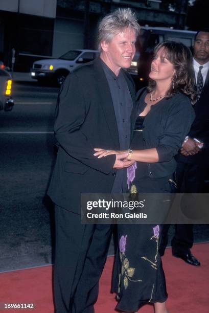 Actor Gary Busey and wife Tiani Warden attend the Screening of the TNT Original Movie "Rough Riders" on July 17, 1997 at the Academy Theatre in...