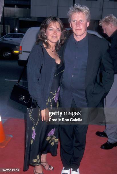 Actor Gary Busey and wife Tiani Warden attend the Screening of the TNT Original Movie "Rough Riders" on July 17, 1997 at the Academy Theatre in...