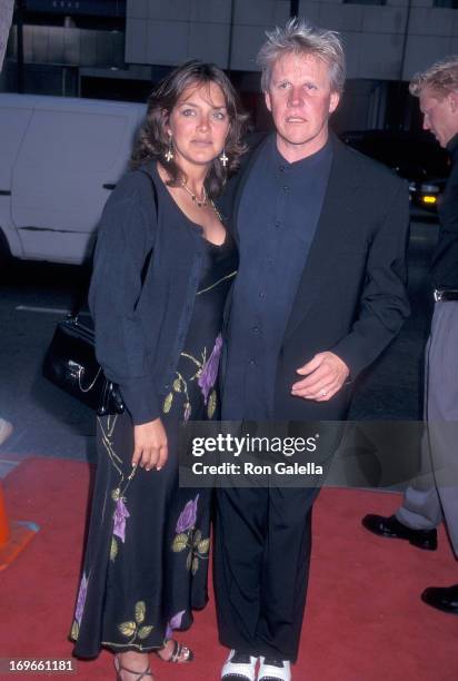 Actor Gary Busey and wife Tiani Warden attend the Screening of the TNT Original Movie "Rough Riders" on July 17, 1997 at the Academy Theatre in...