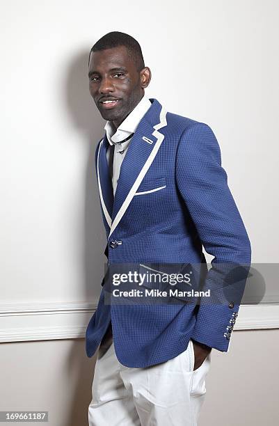 Wretch 32 poses for Stella/Esquire Portrait Studio at Somerset House on May 29, 2013 in London, England.