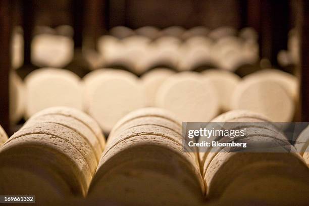 Roquefort Societe 150years cheeses sit on maturing racks in caves at the Lebrou-Roquefort plant, part of Groupe Lactalis SA, in Roquefort, France, on...