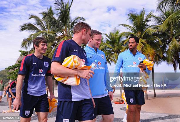 Leighton baines, James Milner, Wayne Rooney and Joleon Lescott walk back to the hotel after the England team warm down session on Copacabana Beach...