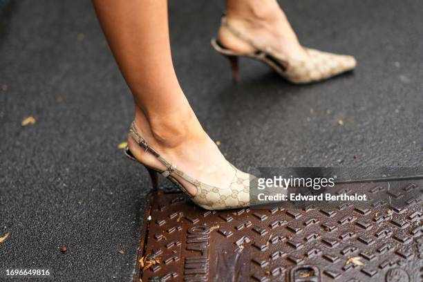 Guest wears Gucci monogram pointed shoes, outside Gucci, during the Milan Fashion Week - Womenswear Spring/Summer 2024 on September 22, 2023 in...