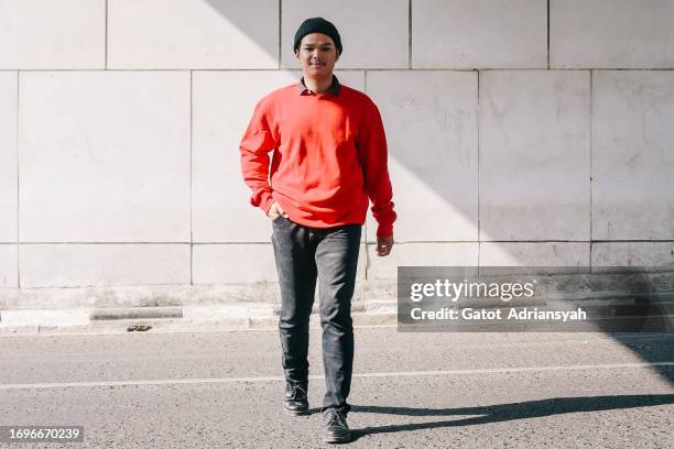 portrait of young stylish asian man - indonesia street stock pictures, royalty-free photos & images