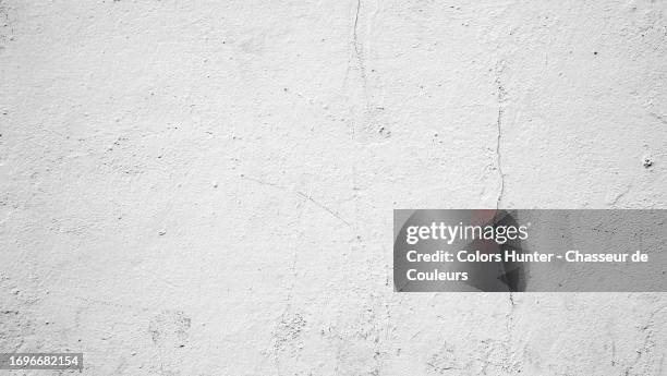 empty and clean concrete wall painted white with cracks and texture in london, england united kingdom - boundary wall stock pictures, royalty-free photos & images