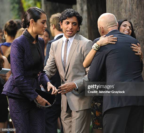 Emma Heming, M. Night Shyamalan and Bruce Willis attend the "After Earth" premiere at Ziegfeld Theater on May 29, 2013 in New York City.