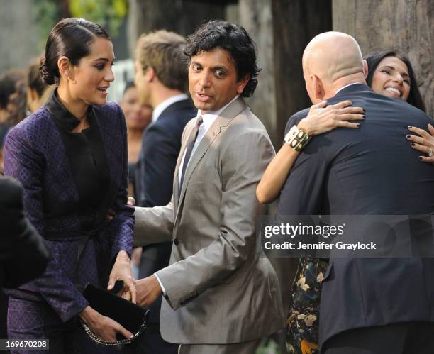 Emma Heming, M. Night Shyamalan and Bruce Willis attend the "After Earth" premiere at Ziegfeld Theater on May 29, 2013 in New York City.