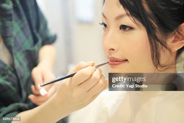 women have make-up by stylist - makeup artist stock pictures, royalty-free photos & images