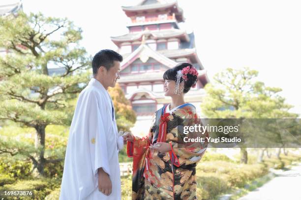 a japanese couple in wedding kimonos - tradition stock pictures, royalty-free photos & images