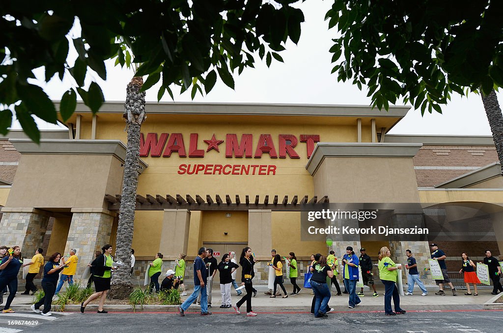 Walmart Workers Begin Bus Rally Heading To Protest At Company's Annual Meeting