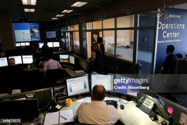 Engineers work at the Boeing Commercial Aviation Services Operations Center in Tukwila, Washington, U.S., on Wednesday, May 29, 2013. Boeing Co.,...