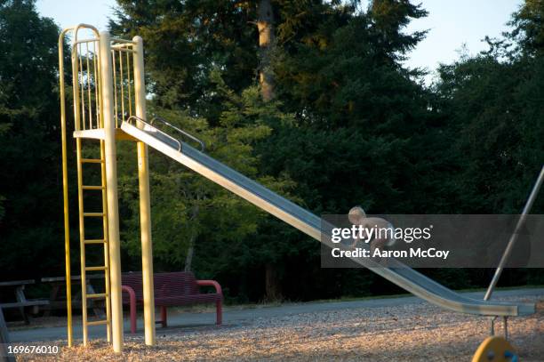 up the slide - toboggan photos et images de collection