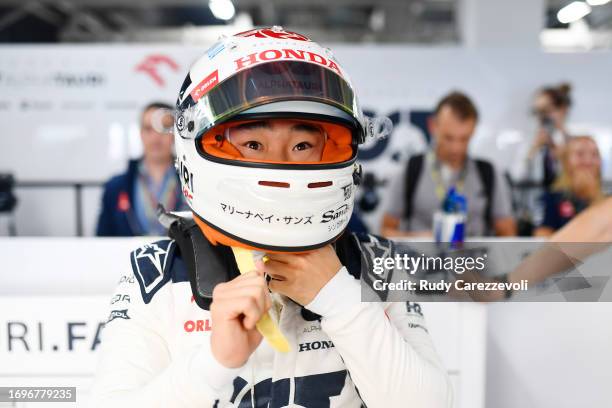 Yuki Tsunoda of Japan and Scuderia AlphaTauri prepares to drive in the garage during qualifying ahead of the F1 Grand Prix of Japan at Suzuka...