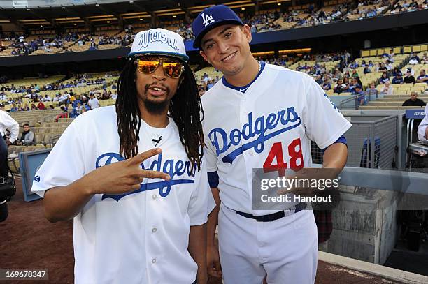 In this handout photo provided by the Los Angeles Dodgers, Lil Jon , rapper, record producer, entrepreneur and international DJ who was a member of...