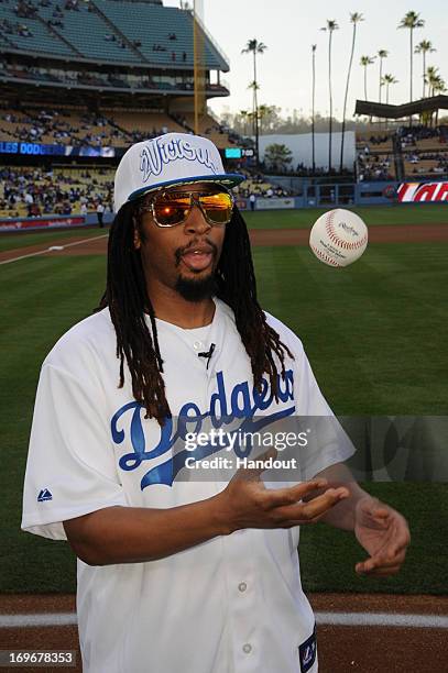 In this handout photo provided by the Los Angeles Dodgers, Lil Jon, rapper, record producer, entrepreneur and international DJ who was a member of...