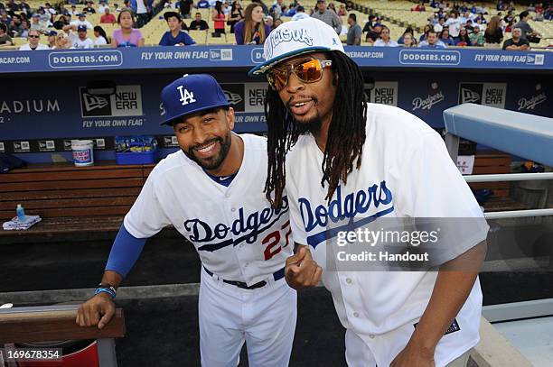 In this handout photo provided by the Los Angeles Dodgers, Lil Jon , rapper, record producer, entrepreneur and international DJ, who was a member of...
